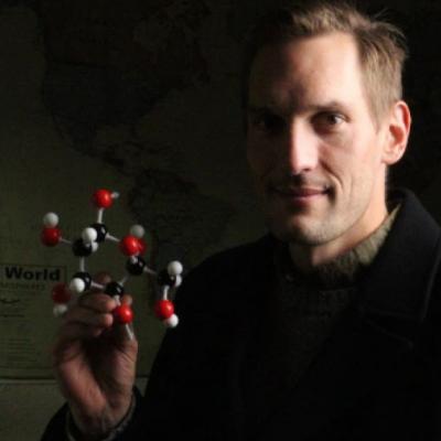 Jason with a model of a cellulose molecule, the most abundant organic compound on Earth, and one of the materials his company utilizes to deliver carbon-conscious alternatives to traditional design and structures.  